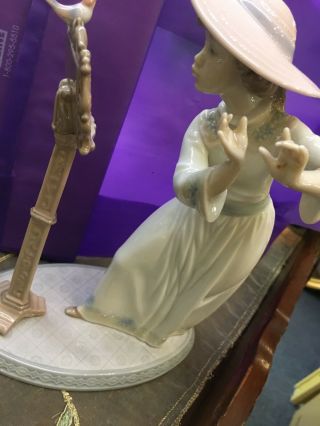 lladro girl playing the flute 2