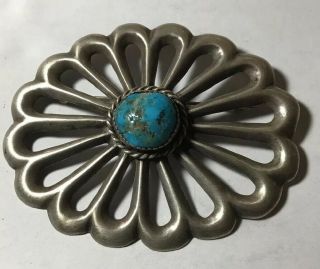 Vintage Sterling Silver Large Sand Cast Brooch With A Turquoise Cabochon Center.