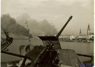 Press Photo: Great German 2cm Flak Gun By River & Burning Fires; Minsk,  Russia