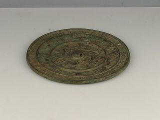 A Tang Dynasty Style Bronze Mirror With High Relief Of 4 Mythological Creatures