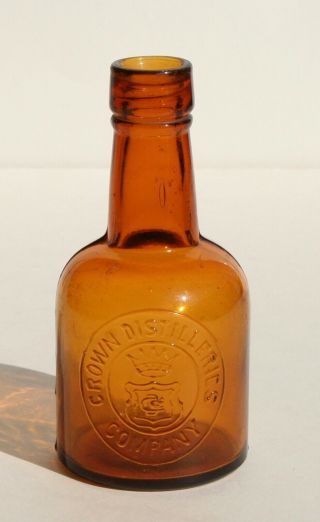 Old Amber Glass Crown Distilleries Company Bottle