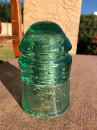 Great Old Soldier Cd 126.  4 W.  E.  Mfg.  Co.  Green Glass Insulator Pat Applied For