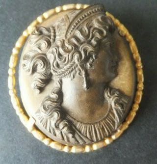 Late 19th Century,  French,  Volcanite,  exquisitely carved gilded broach. 2