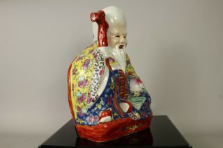 A Chinese famille rose porcelain figure of seated Shouxing 20thc Republic 2