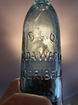 S.  L.  O.  Soda Water S.  Ceribelli Ca Gravitating Glass Stopper Hutch Bottle