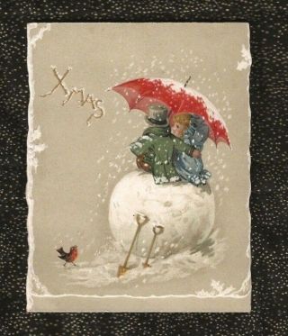 Victorian Christmas Card Embossed Children Sitting On Snowball With Umbrella