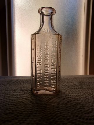 The Palm Pharmacy,  Nixon,  Texas Embossed Drug Store Bottle C.  1900 - 1910