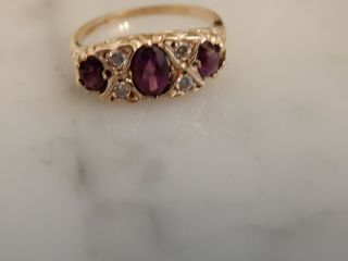 A 9 Ct Gold Amethyst And White Sapphire Ring