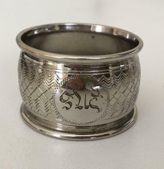 Heavy Victorian silver napkin ring with very strange engraving.  Can you identify? 2