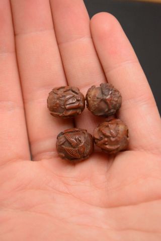 Group Of Four Fine Antique Chinese Heidao Nut Carved Beads