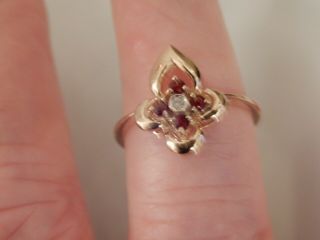 A 9 Ct Gold Ruby And Diamond Floral Ring