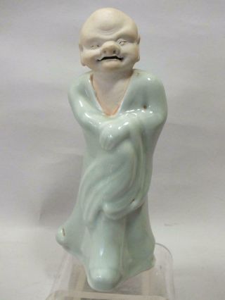 A Chinese Porcelain Celadon And Bisque Figure Of A Man 20thc