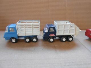 4 vintage metal tonka toy trucks and catipillar 3