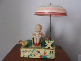 Vintage " Happy Life " Tin Litho Wind Up Toy,  Celluloid Girl On The Beach,  1950s