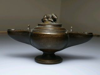 A 19th Century Oriental Chinese Bronze Oil Lamp Decorated With A Mouse Lid.