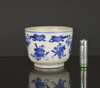 A CHINESE KANGXI PERIOD SMALL BLUE & WHITE BOWL WITH PRECIOUS OBJECTS 2
