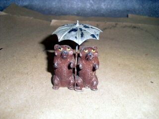 Rare Vintage Lead Miniature Raccoons Holding Signed Metal Umbrella Look