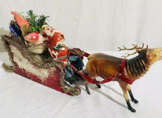 Antique German Santa Seated In Tin Sleigh Of Toys Pulled By Composition Reindeer