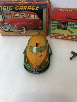 1950s tin key wind up Yonezawa tin toy Japan MAGIC GARAGE With car futuristic 2