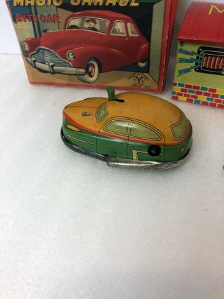 1950s tin key wind up Yonezawa tin toy Japan MAGIC GARAGE With car futuristic 3