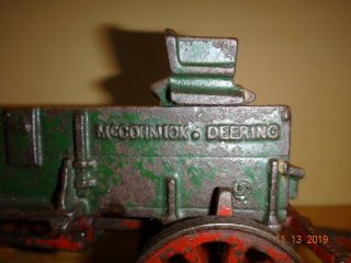 ARCADE MCCORMICK DEERING CAST IRON TOY WAGON WITH SEAT AND DOUBLE HITCH 2