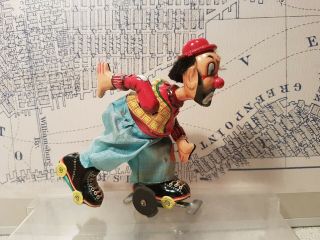 Tin Toy T.  P.  S.  Roller Skating Clown,  Wind Up Toy,  Japan,  (see Movie)