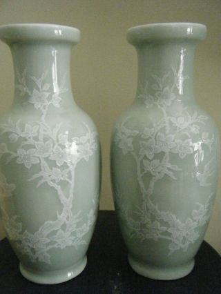 A Celadon Green Porcelain Vase With Cherry Blossem Flowers And Birds