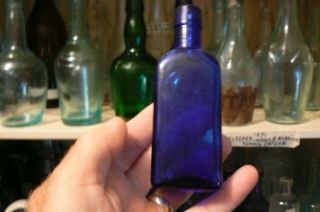 1890 s COBALT BLUE GARGLING OIL LOCKPORT,  N.  Y.  PATENT MEDICINE BOTTLE 2