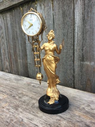 Vintage Linden 8 Day Swinging Arm Lady Statue Clock,