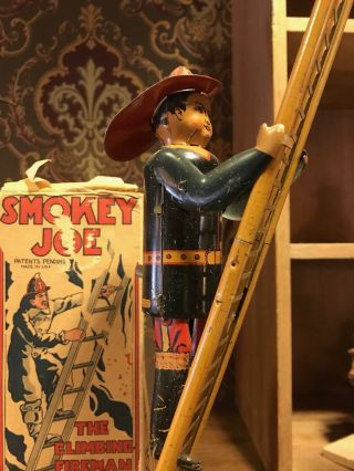 Smokey Joe Climbing Fireman W/ Box Climbs Ladder By Marx 1930 