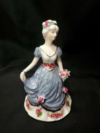 Vintage Porcelain Victorian Lady Figurine Holding Flowered Hat
