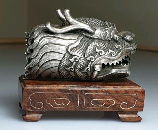 A Late Qing Dynasty Chinese Silver Dragons Head.