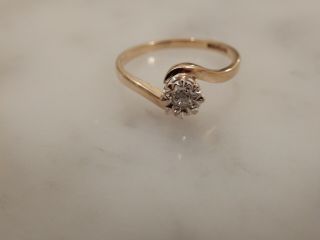A 9 Ct Gold Solitaire Diamond Twist Ring