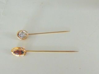 Gold Stick Pins.  1 - 14kt—1 - 10kt.  14kt W/ Diamond.  10kt W/ Yellow Topaz Stone