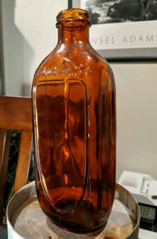 The Owl Drug Co.  Brown Amber Medicine Bottle.  Unknown Year.  Curved Label Areas