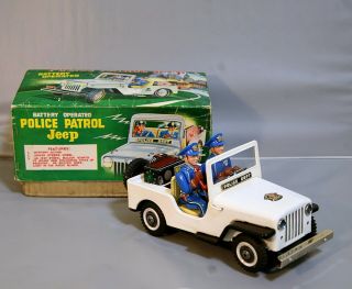 T.  N Nomura Tin police jeep battery operated 60s japan top (video) 2