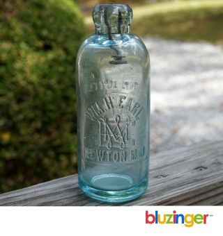 Wm.  H.  Earl Newton N.  J.  Aqua Blob Top Hutch Soda Water Bottle