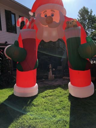 Gemmy Airblown Christmas Inflatable Animated Santa Mustache Archway.