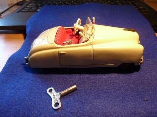 Schuco Cream Radio 4012 Clockwork Car With Key.  Needs Some Tlc.
