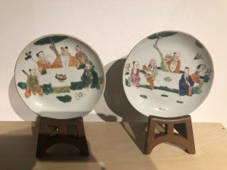A Chinese Porcelain Famille Rose Saucers On Wooden Stands
