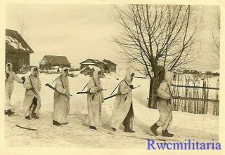 Move Out Wehrmacht Combat Patrol In Snow Camo Leaving Village; Russia