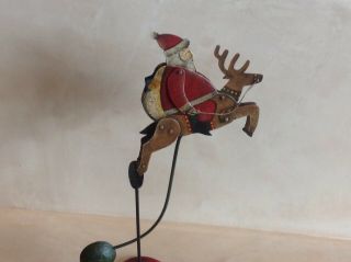 Vintage Hand Painted Folk Art Christmas Santa On Reindeer Pendulum Balancing Toy