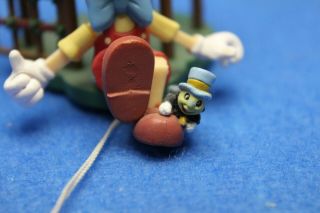 Enesco Disney Pinocchio Puppet Cage Jiminy Cricket Christmas ornament arms move 3
