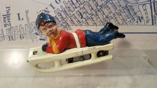 German Tin Toy,  Penny Toy,  Boy On Sled/sleigh Wind Up -