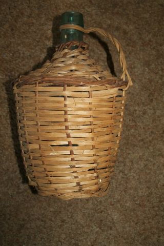Vintage Green Wine Bottle In Wicker Basket