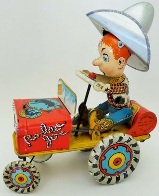 Vintage Unique Arts Rodeo Joe Crazy Car Tin Lithographed Mechanical Toy 8.  25 "