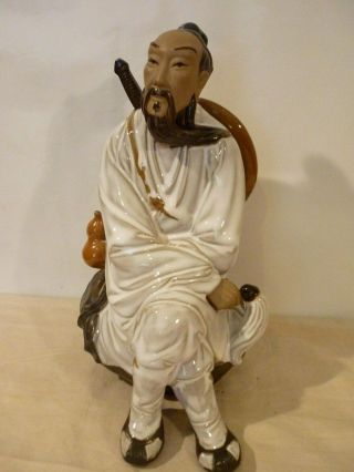 Shiwan Mud Man Figure Swords Man Sitting.  9.  5 "