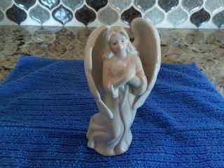 Unmarked Porcelain Angel Figurine Holding A Flower,  Approximately 4 1/2 " Tall
