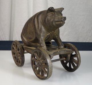 Vintage Cast Iron Sitting Pig Pull Toy - 57310