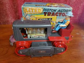 vintage tin toy lighted piston action tractor made in japan 3